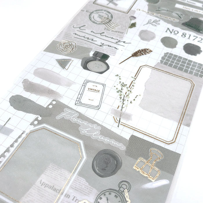 Mind Wave Libre Collage Stickers Gray Elevate your aesthetic with these exquisite vintage-inspired stickers crafted from delicate tracing paper and embellished with elegant foil accents.