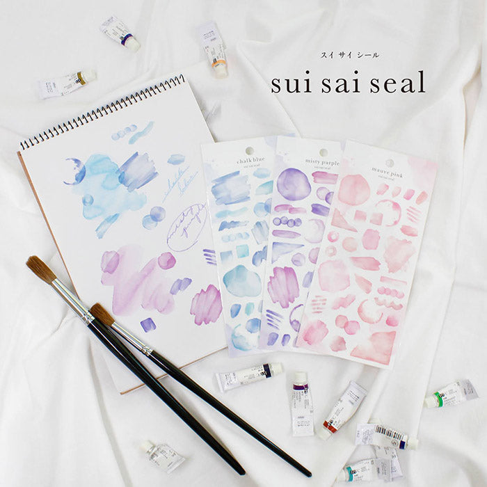 Mind Wave Sui Sai Watercolor Stickers Chalk Blue These stickers are perfect for all paper projects, adding a unique touch with their transparent watercolor look. Spice up your planners, cards, and more with these elegant and artistic stickers.