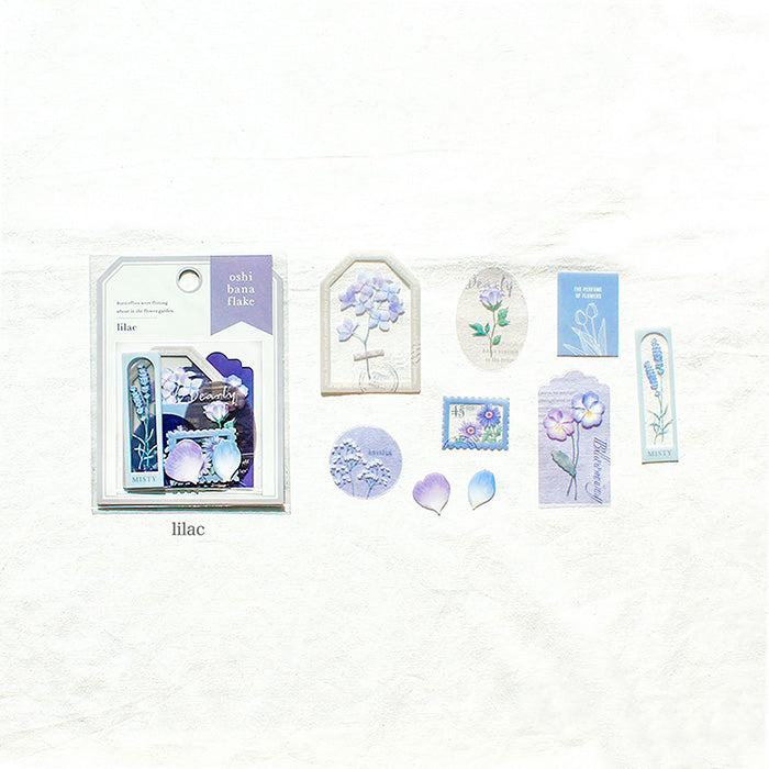 Mind Wave Oshi Bana Flower Sticker Flakes Lilac  Add a touch of elegance to your papercraft projects with these color-coordinated Oshi Bana Flower PET -Sticker Flakes. This set includes exquisite flower and frame stickers that will elevate your planners, journals, or any other papercraft projects.