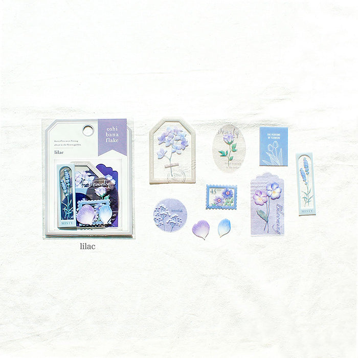 Mind Wave Oshi Bana Flower Sticker Flakes Lilac Add a touch of elegance to your papercraft projects with these color-coordinated Oshi Bana Flower PET -Sticker Flakes. This set includes exquisite flower and frame stickers that will elevate your planners, journals, or any other papercraft projects.