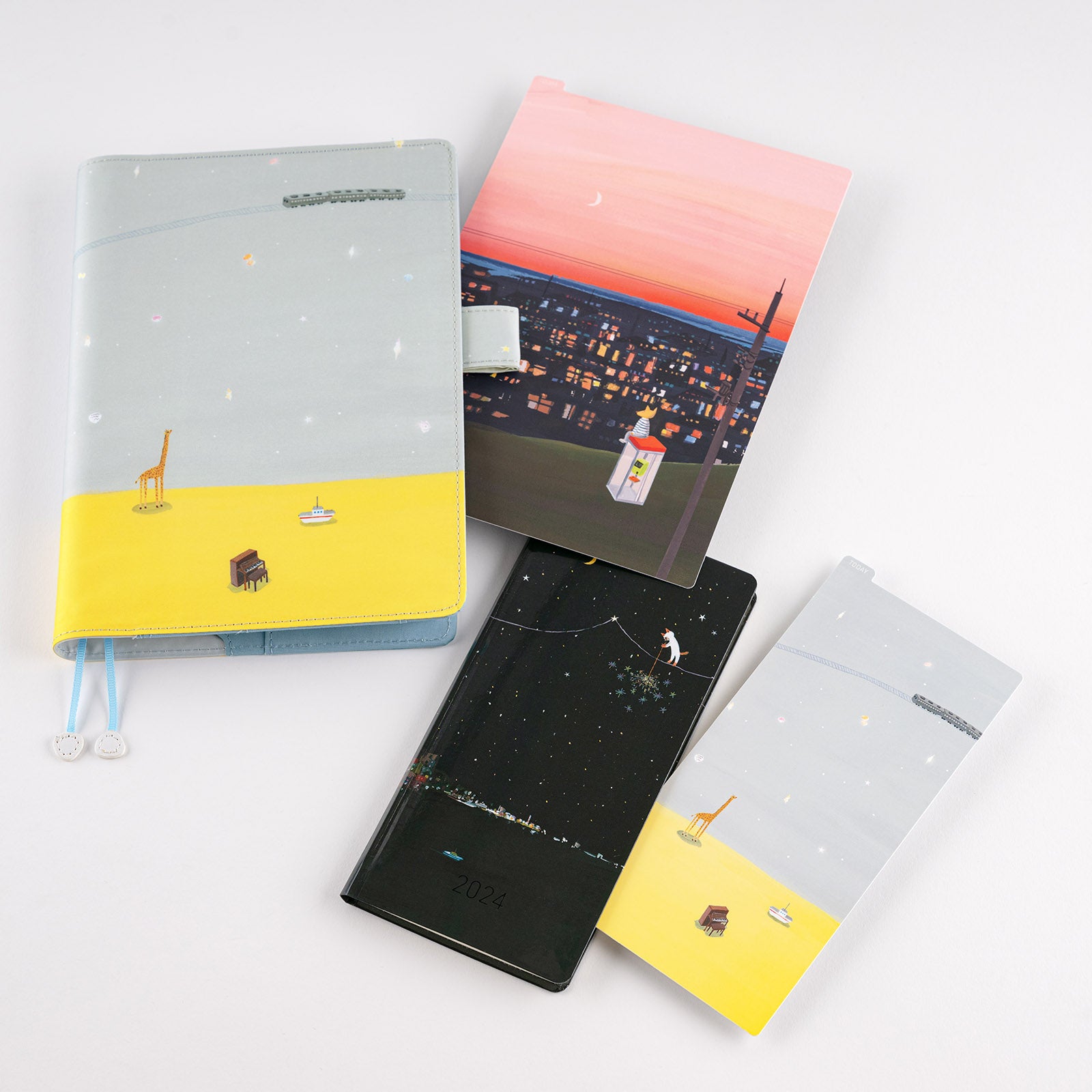Hobonichi Hiroko Kubota: Pencil Board for A5 Size (Count the Lights) This pencil board features artwork by Hiroko Kubota. The Hobonichi pencil boards are designed to use underneath the page you are writing on to keep your writing experience even smoother.