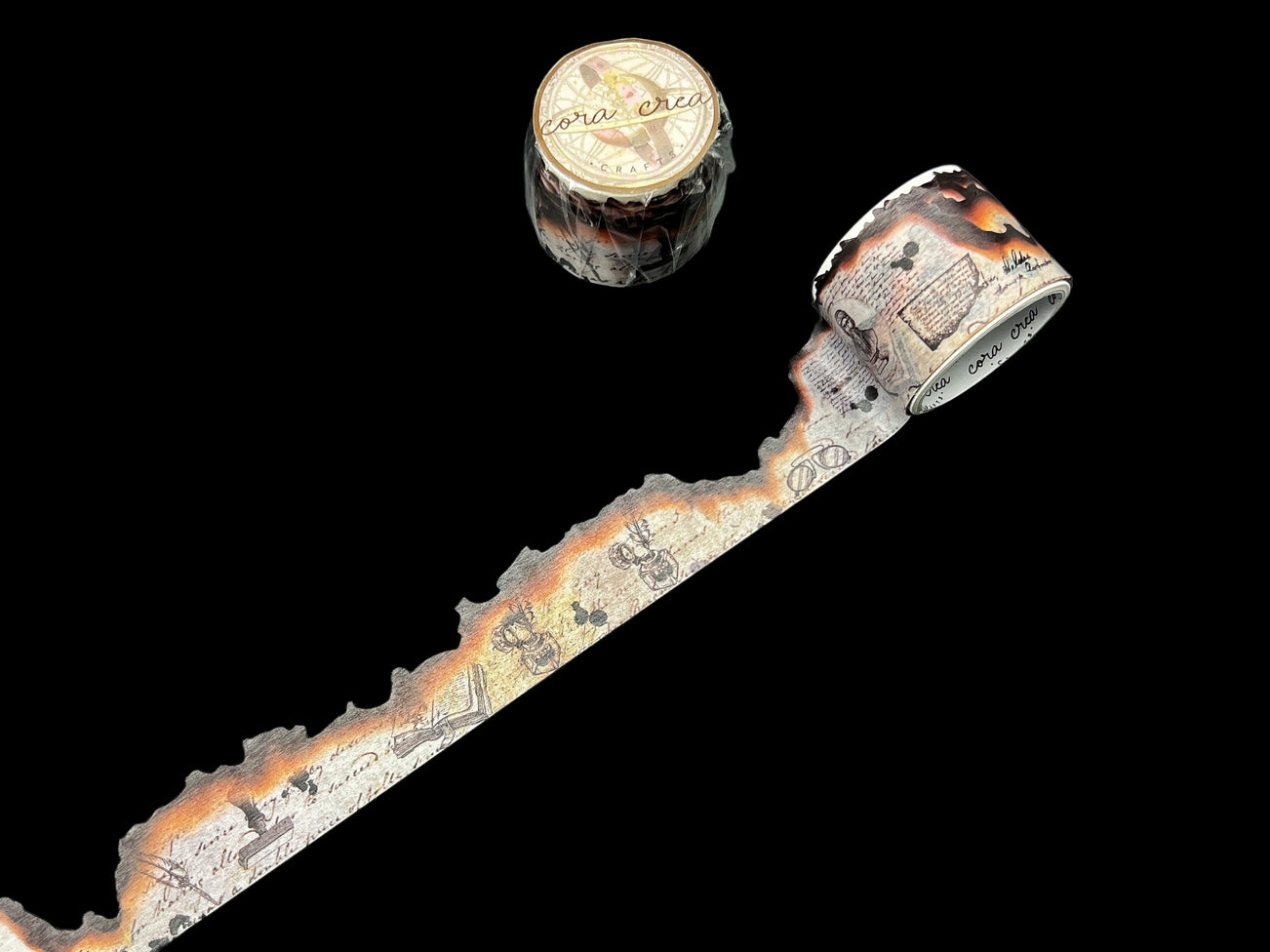 CoraCreaCrafts Burnt Edges Washitape A unique vintage style washi tape designed by CoraCreaCrafts. It features a manuscript style paper with die cut burnt edges.