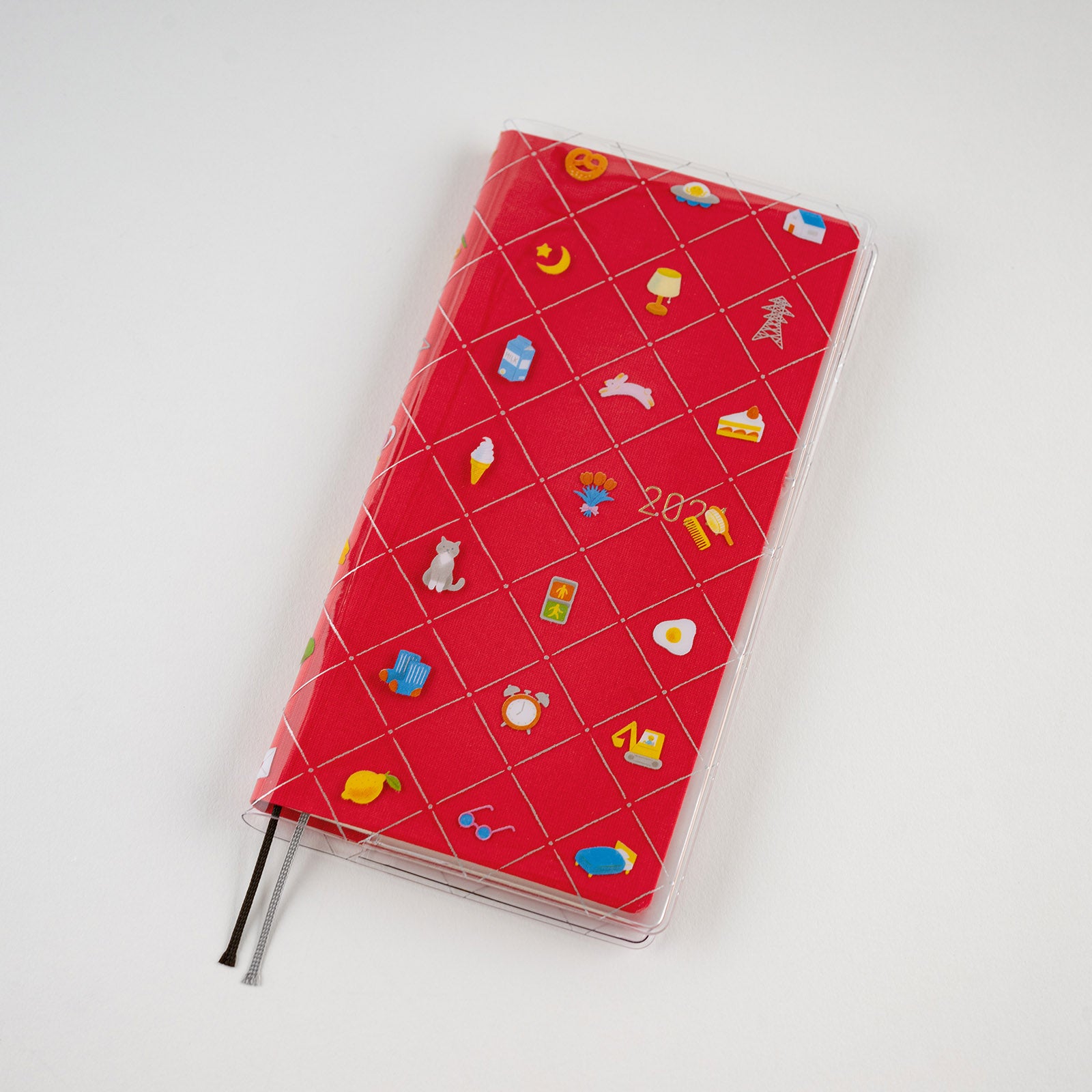 Hobonichi Kanako Kagaya: Clear Cover for Weeks (Familiar Sights) This is a protective cover that can be used on top of your Hobonichi Weeks to protect it from wear and tear. You can also store illustrations under your cover on cover to boost your Hobonichi covers design. This Weeks cover on cover also has a pen loop. The design for “Familiar Sights” was created by designer and illustrator Kanako Kagaya.