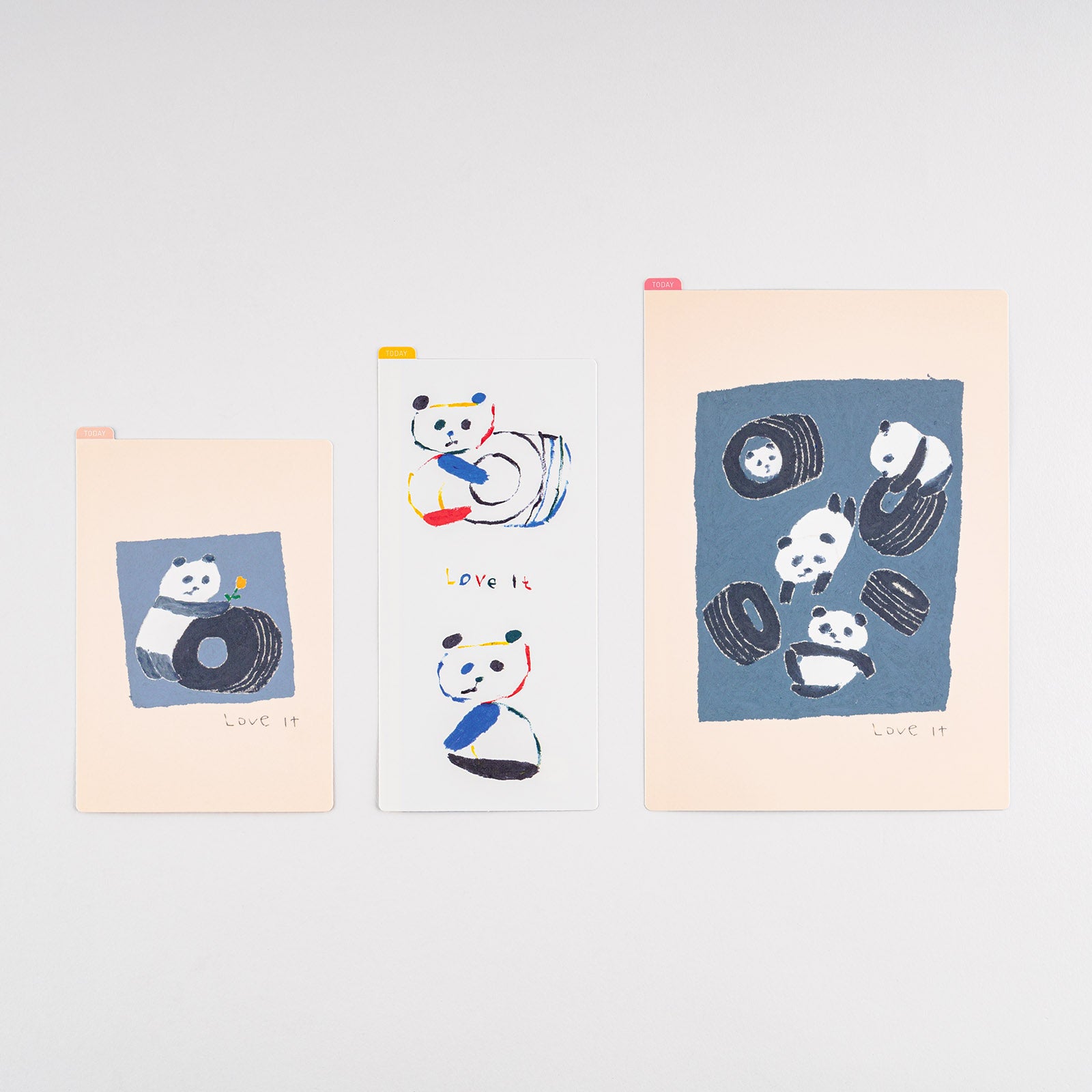 Hobonichi Jin Kitamura: Hobonichi Pencil Board for A6 Size (Love it (Panda)) This pencil board features pandas drawn by illustrator and children’s book author Jin Kitamura. The Hobonichi pencil boards are designed to use underneath the page you are writing on to keep your writing experience even smoother.