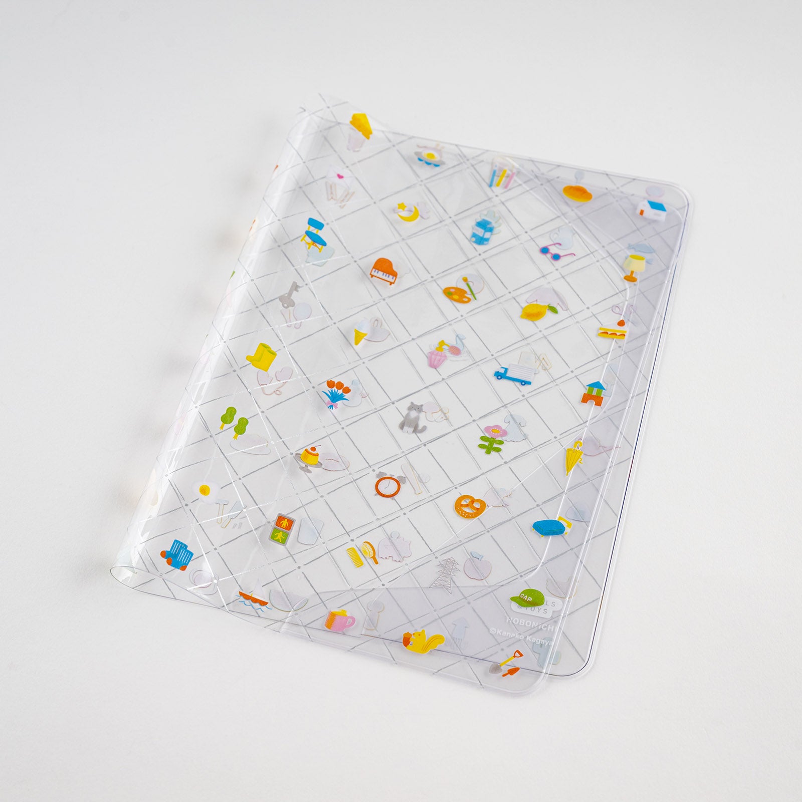 Hobonichi Kanako Kagaya: Cover on Cover for A5 Size (Familiar Sights) Cover on cover is a protective cover that can be used on top of your Hobonichi Cousin cloth covers to protect them from wear and tear. This product can not be used on top of the book only. You can also store illustrations under your cover on cover to boost your Hobonichi covers design. The design for “Familiar Sights” was created by designer and illustrator Kanako Kagaya.