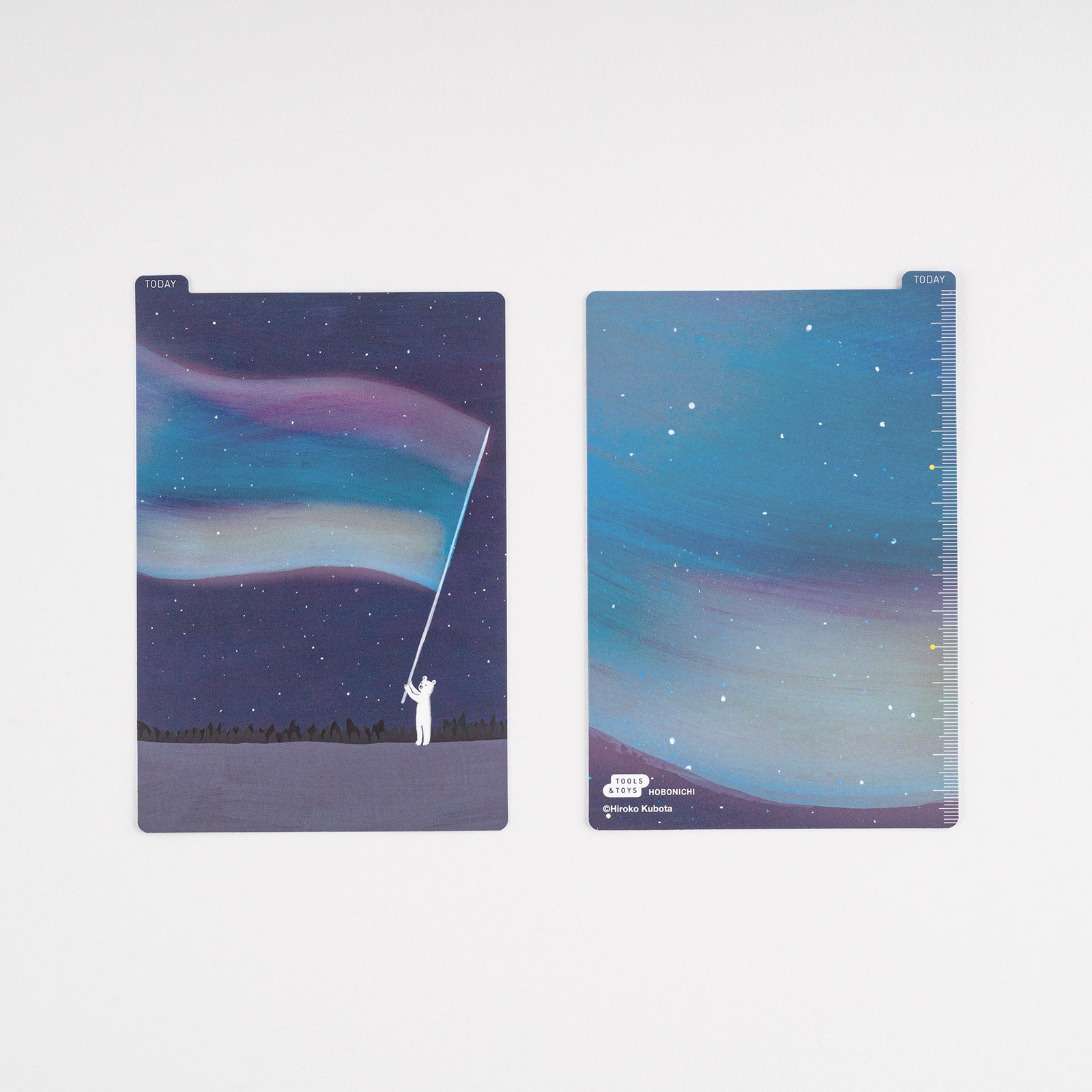 Hobonichi Hiroko Kubota: Pencil Board for A6 Size (Aurora Duty) This pencil board features artwork by Hiroko Kubota.  The Hobonichi pencil boards are designed to use underneath the page you are writing on to keep your writing experience even smoother.