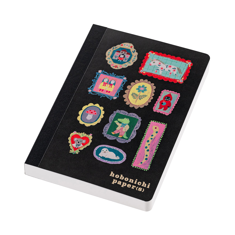 Hobonichi Yumi Kitagishi: Hobonichi Paper(s) Notebook (Take a Look) This A6 notepad has 155 pages. The paper inside is blank except for a lightly printed illustration, and the pages are glued in instead of sewn, making them very easy to rip out for shopping lists or passing along messages. The cover artwork is by illustrator Yumi Kitagishi titled Take a Look.