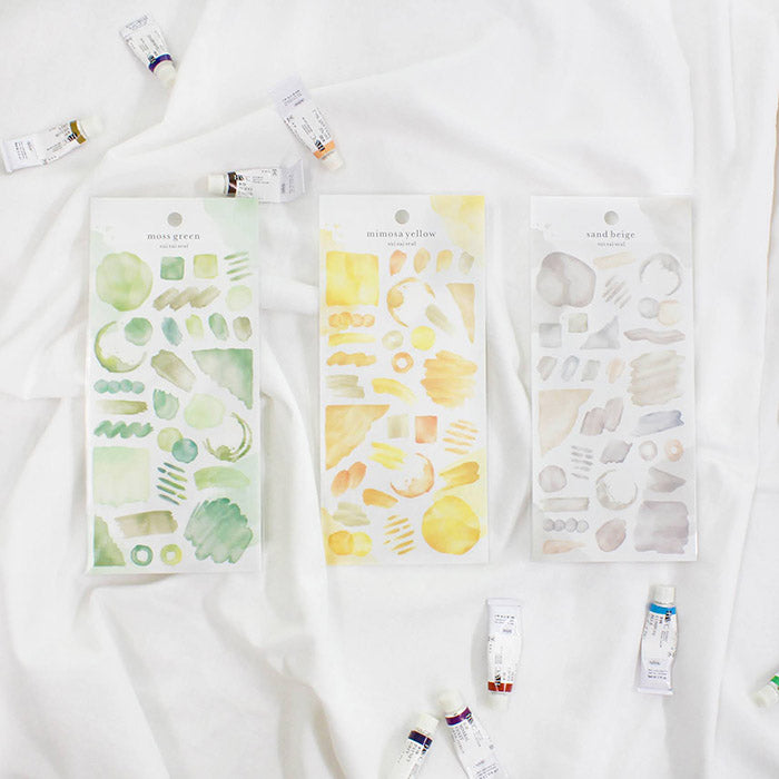 Mind Wave Sui Sai Watercolor Stickers Moss Green  These stickers are perfect for all paper projects, adding a unique touch with their transparent watercolor look. Spice up your planners, cards, and more with these elegant and artistic stickers.