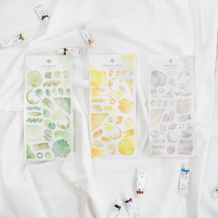 Mind Wave Sui Sai Watercolor Stickers Sand Beige  These stickers are perfect for all paper projects, adding a unique touch with their transparent watercolor look. Spice up your planners, cards, and more with these elegant and artistic stickers.
