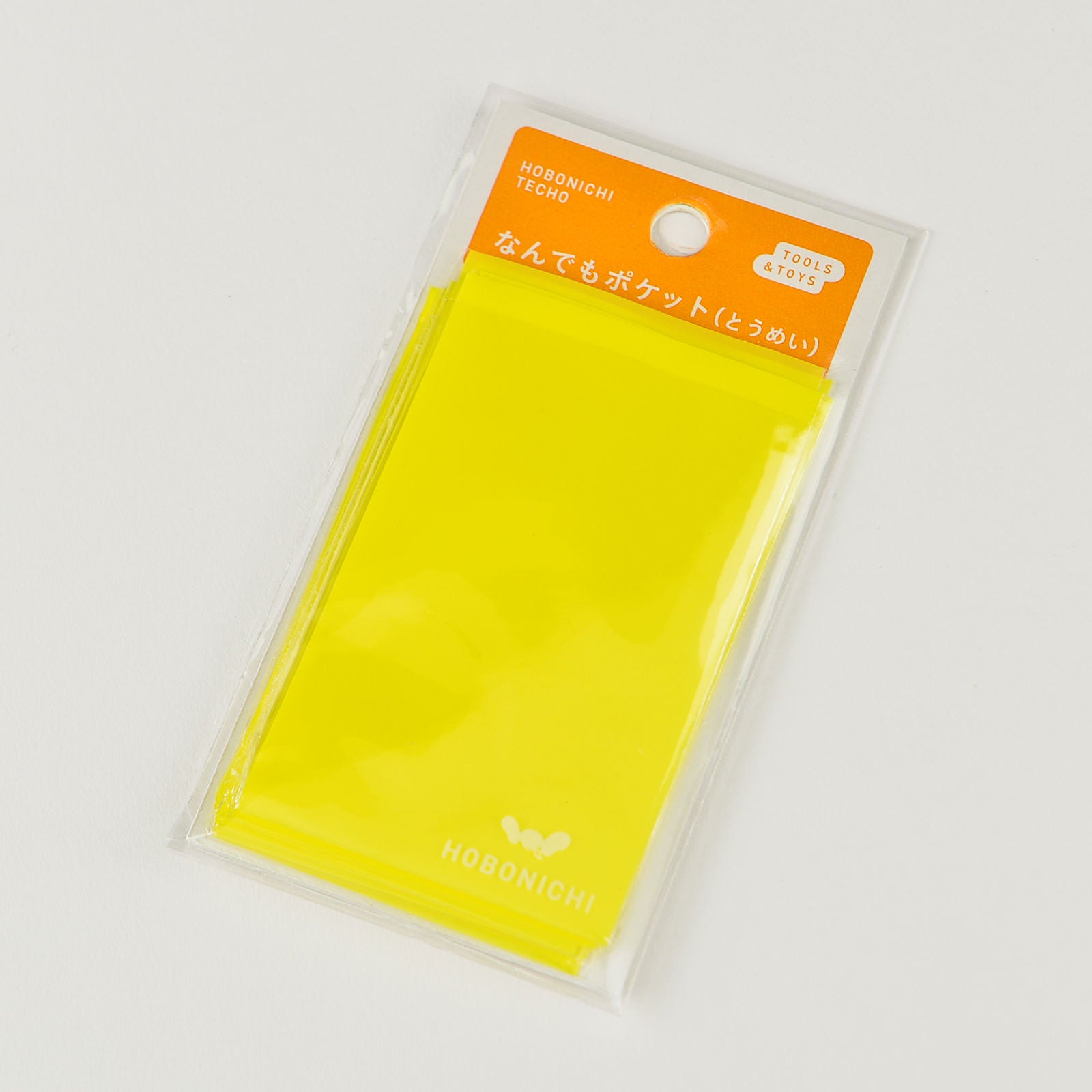 Hobonichi Anything Pocket Clear  This adhesive clear envelope can be attached to a page in your techo and provide a storage pocket. Pocket is made of thin plastic, so it does not make your Hobonichi bulky.  The Anything Pocket is useful for keeping things in your techo that you would prefer not to tape directly to the page. It can be used to store tickets, papers, stickers etc. 