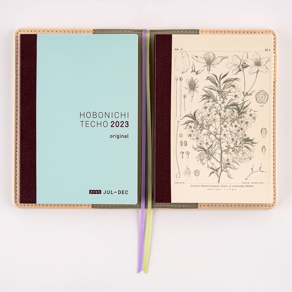 Hobonichi Plain Notebook A6 Tomitaro Makino : Yamazakura Notebook features an illustration of a Yamazakura cherry tree created by the botanist Tomitaro Makino in 1900. Makino is known for his detailed works of art.  This notebook has Tomoe River paper, opens completely flat, and contains graph paper divided into 4 colors.
