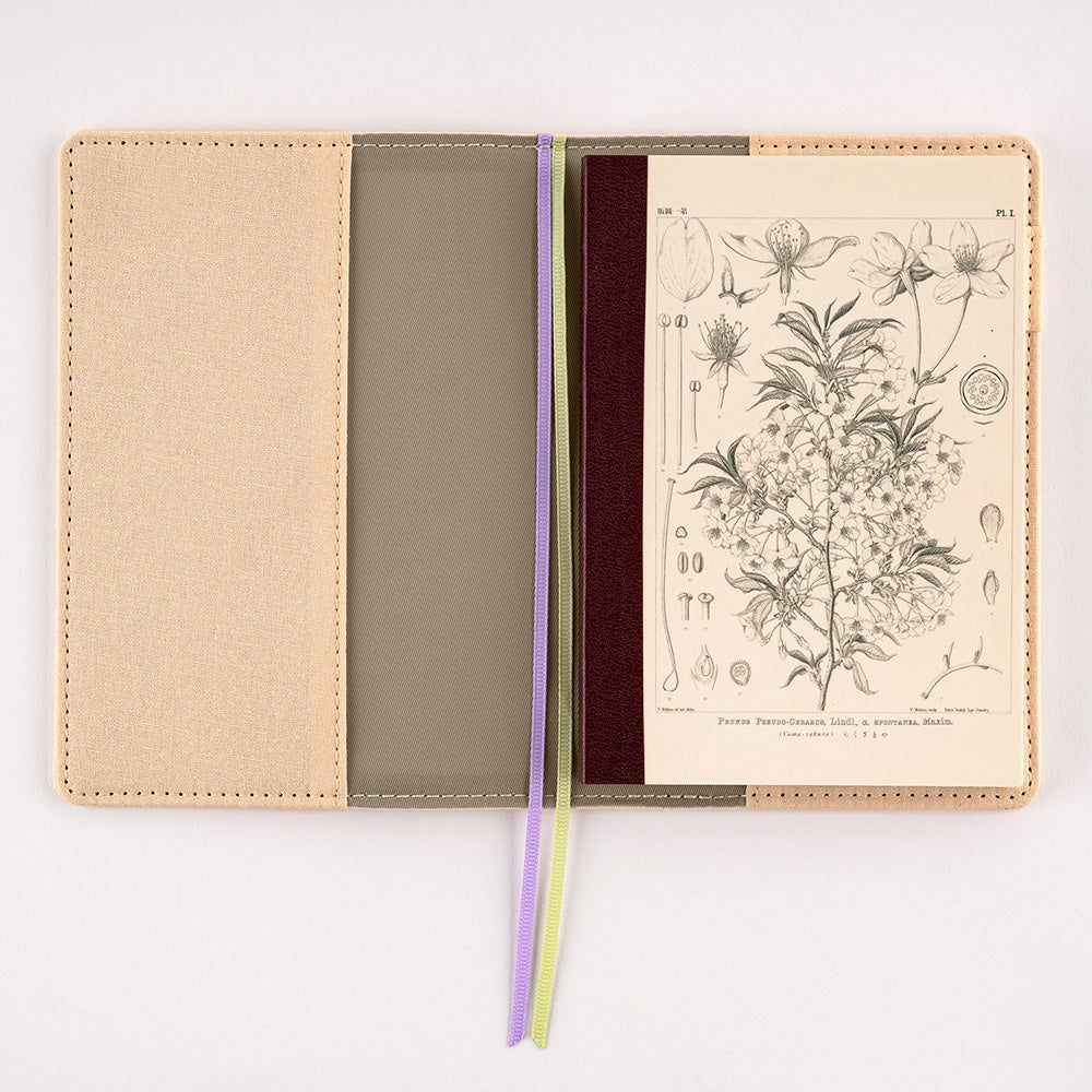 Hobonichi Plain Notebook A6 Tomitaro Makino : Yamazakura Notebook features an illustration of a Yamazakura cherry tree created by the botanist Tomitaro Makino in 1900. Makino is known for his detailed works of art.  This notebook has Tomoe River paper, opens completely flat, and contains graph paper divided into 4 colors.